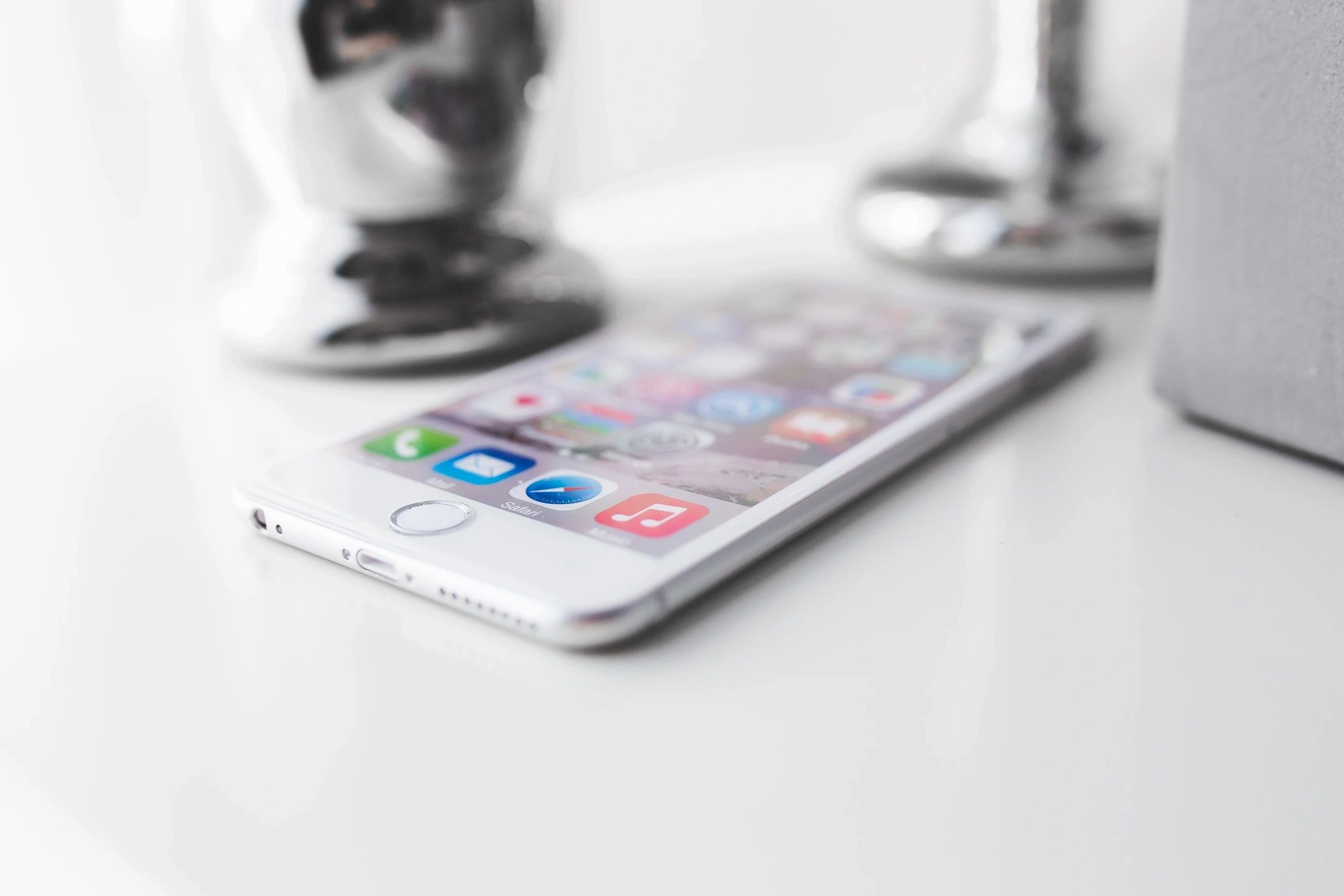 Image Of A White Smart Phone On A White Table