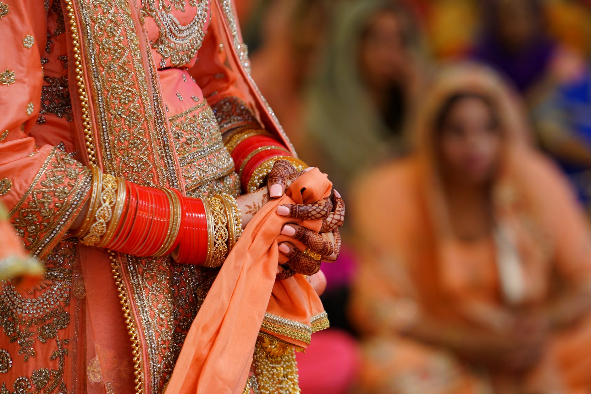 crop unrecognizable indian bride in traditional fancy gown