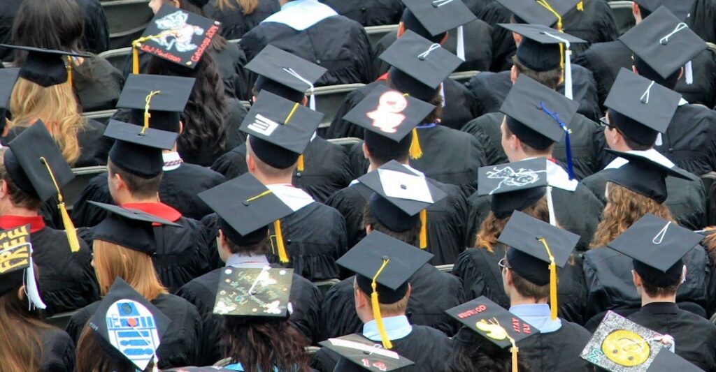 An aerial view of mortarboards worn at a graduation.