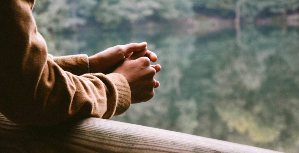 tilt-shift photography of person in brown jacket