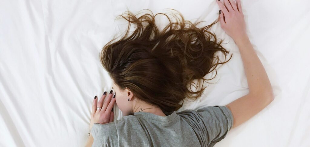 woman lying on bed